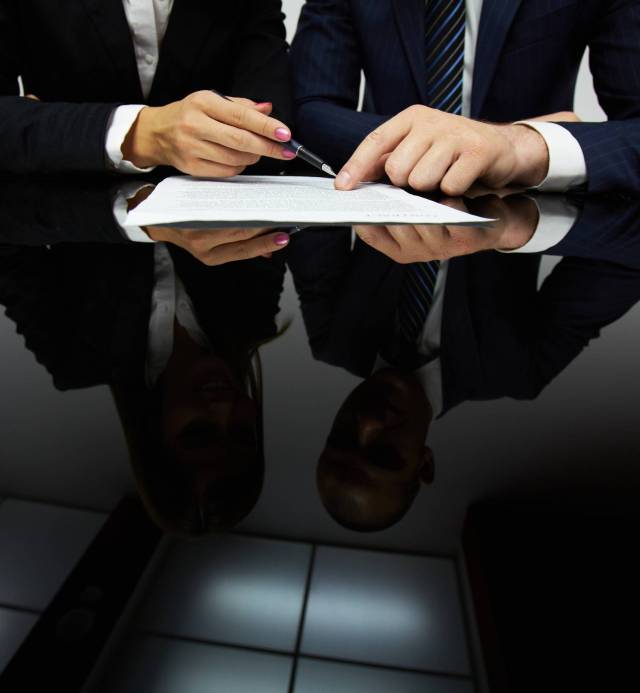 Image of human hands during reading contract